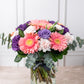 Coral - Gerbera Rosa, Lisianthus Morado y Clavel Rosa