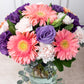 Coral - Gerbera Rosa, Lisianthus Morado y Clavel Rosa